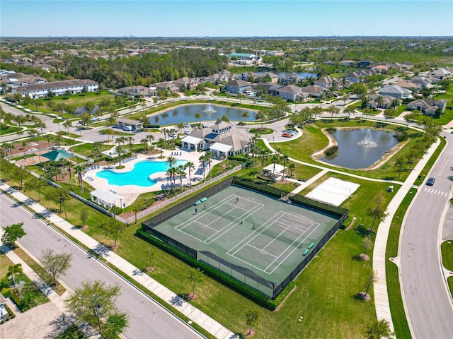 drone / aerial view with a residential view and a water view