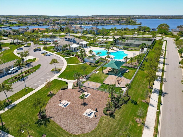 drone / aerial view with a water view and a residential view