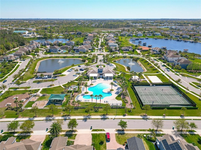 drone / aerial view featuring a water view and a residential view