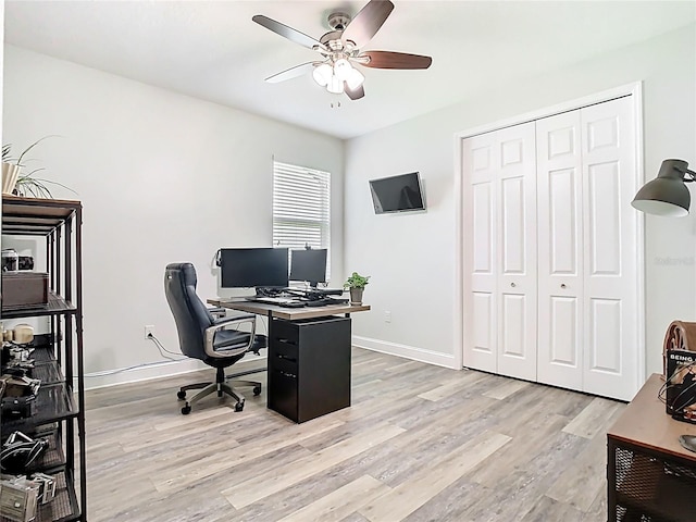 office with light wood-type flooring, baseboards, and ceiling fan