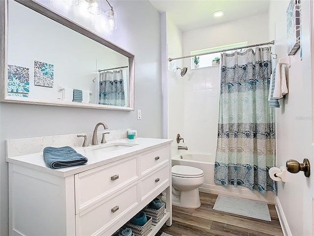 full bathroom with vanity, shower / bath combination with curtain, toilet, and wood finished floors