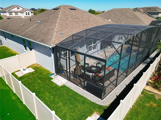 back of house featuring a shingled roof, a patio area, a fenced backyard, and stucco siding