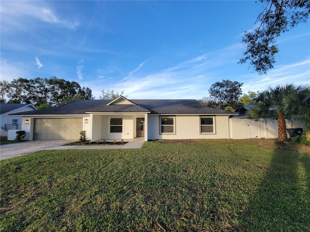 ranch-style home with a front yard, fence, stucco siding, concrete driveway, and a garage