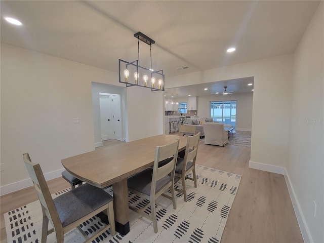 dining room with recessed lighting, visible vents, light wood-type flooring, and baseboards