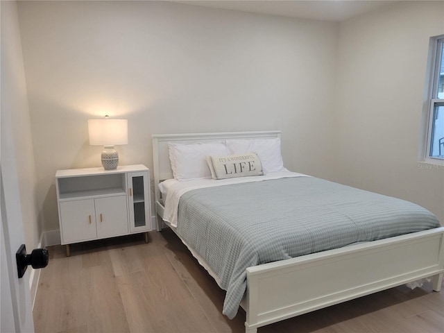 bedroom featuring wood finished floors