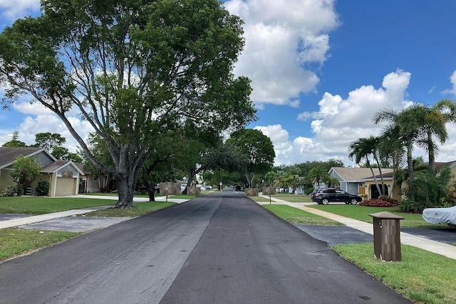 view of road featuring sidewalks and a residential view