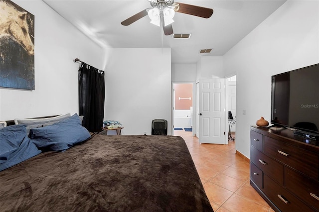 bedroom with light tile patterned floors, visible vents, ensuite bathroom, and ceiling fan