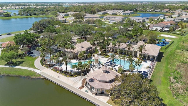 drone / aerial view with a residential view and a water view