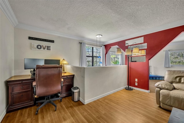 office area with a wealth of natural light, a textured ceiling, wood finished floors, and crown molding