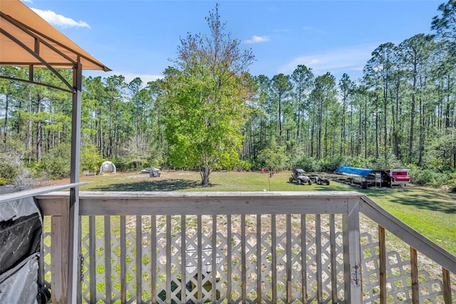 view of yard with a view of trees