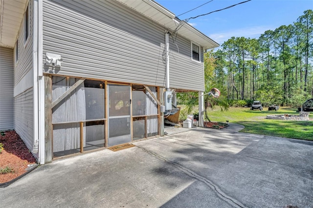 view of property exterior featuring a lawn