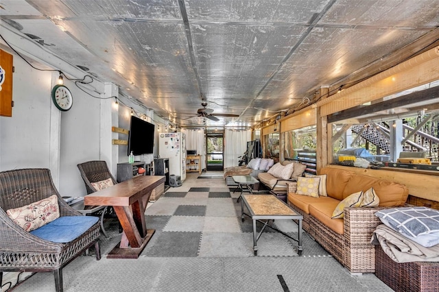 living area with ceiling fan