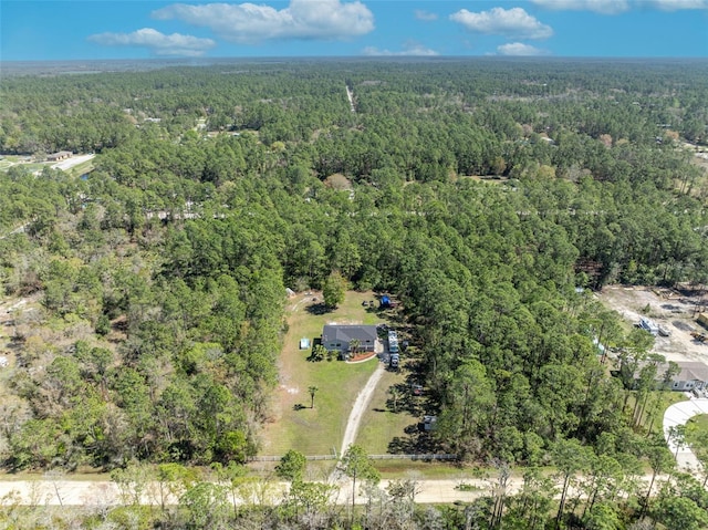 drone / aerial view with a view of trees