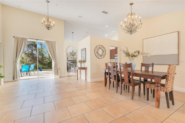 dining area featuring an inviting chandelier, light tile patterned floors, and visible vents