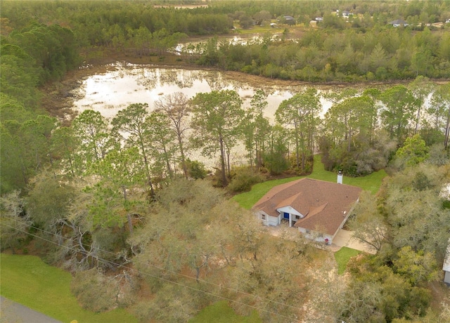 birds eye view of property with a wooded view