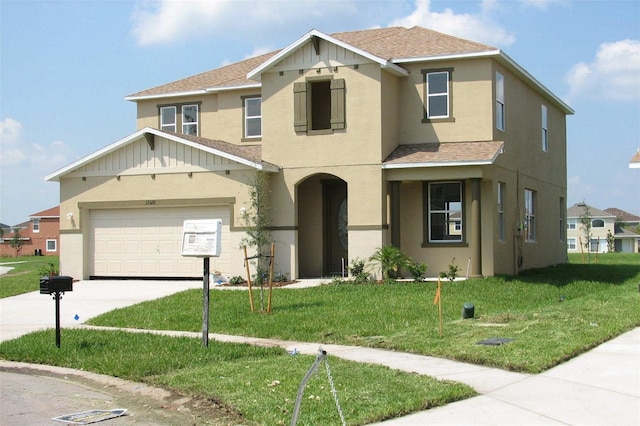 view of front of home featuring stucco siding, concrete driveway, a front lawn, and roof with shingles