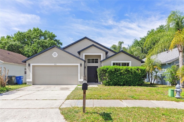 ranch-style home with stucco siding, driveway, an attached garage, and a front lawn