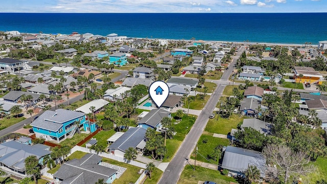 birds eye view of property featuring a residential view and a water view