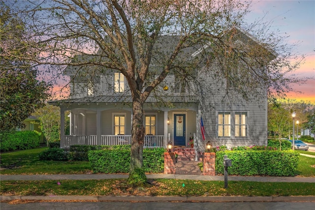 view of front of property featuring covered porch