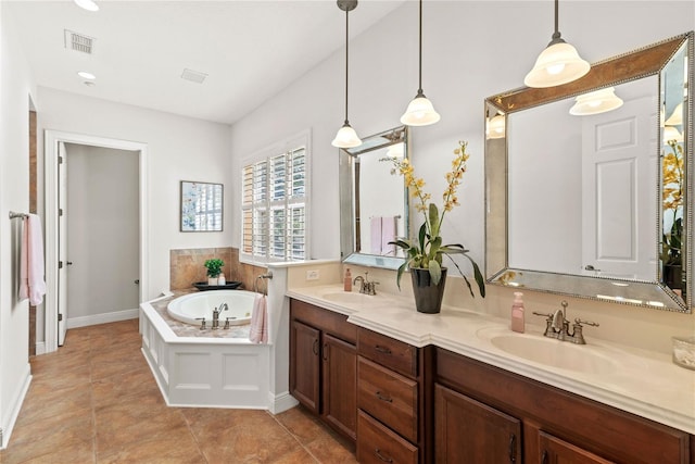 bathroom featuring double vanity, a bath, visible vents, and a sink