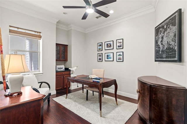 office space with ceiling fan, baseboards, dark wood-style flooring, and ornamental molding