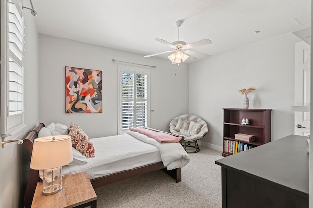 bedroom with carpet, baseboards, and ceiling fan