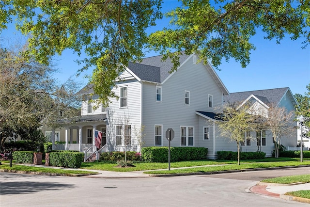 traditional-style house with a front lawn