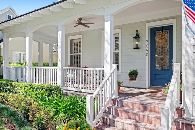 doorway to property with a porch and ceiling fan