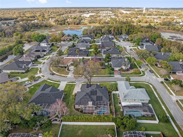 bird's eye view featuring a water view and a residential view