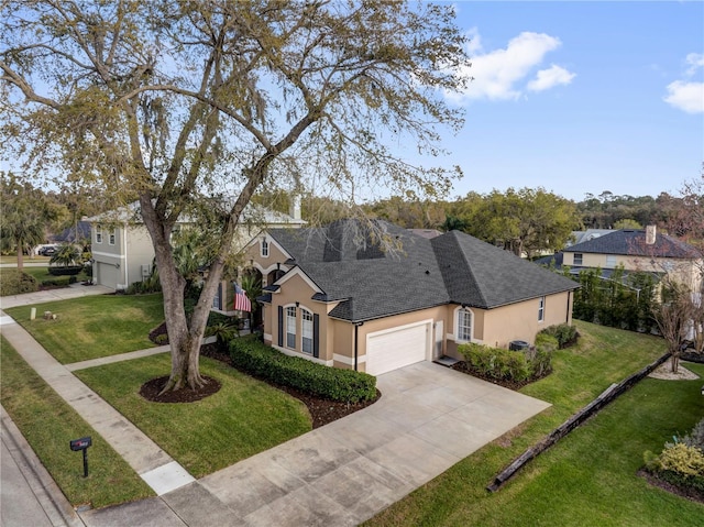 ranch-style home with a front yard, roof with shingles, stucco siding, driveway, and an attached garage