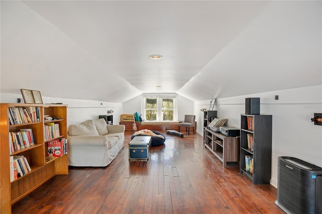 living room with lofted ceiling and hardwood / wood-style flooring