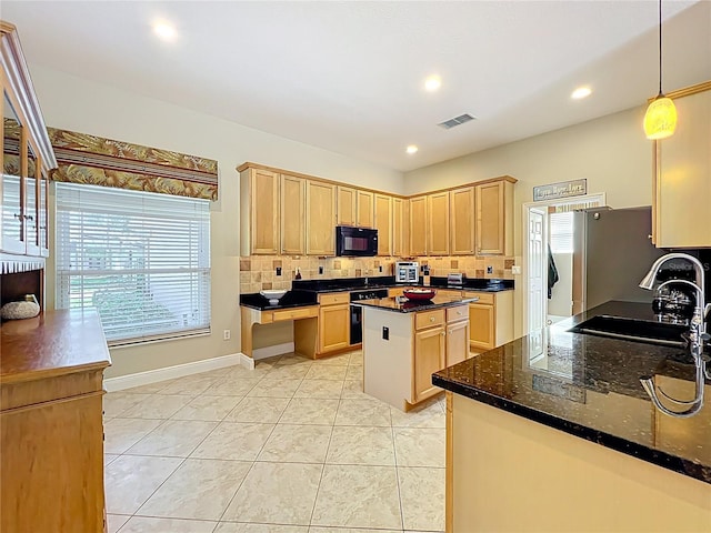 kitchen featuring tasteful backsplash, visible vents, light brown cabinets, and black microwave