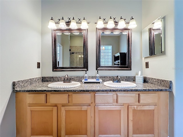 bathroom featuring double vanity and a sink