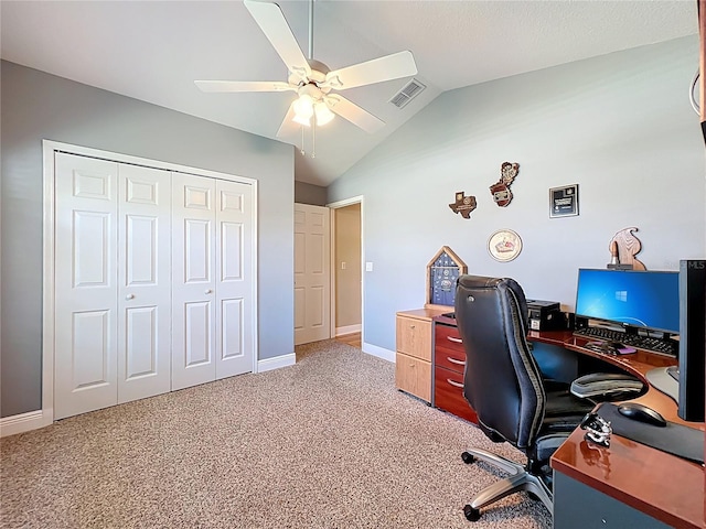 office featuring a ceiling fan, baseboards, visible vents, vaulted ceiling, and light carpet