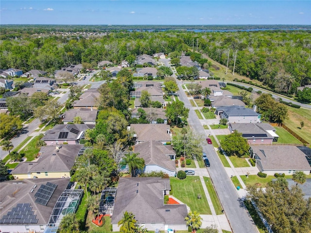 aerial view featuring a residential view and a wooded view