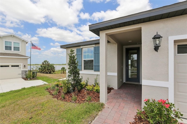 800 Griffon Ave, Lake Alfred, FL 33850 - property entrance featuring stucco siding and a lawn