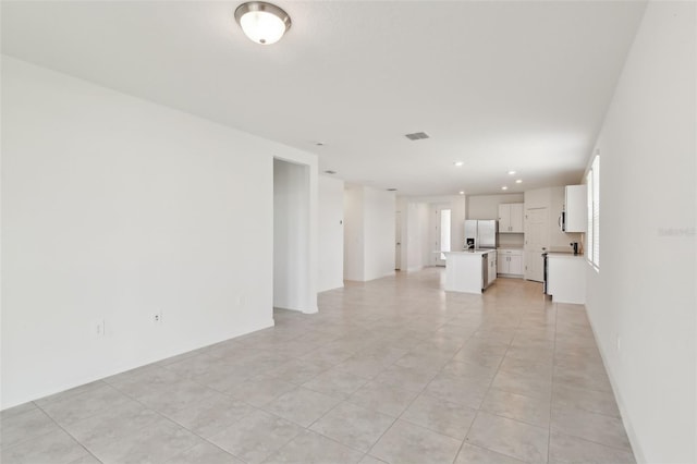 800 Griffon Ave, Lake Alfred, FL 33850 - unfurnished living room featuring recessed lighting and light tile patterned floors