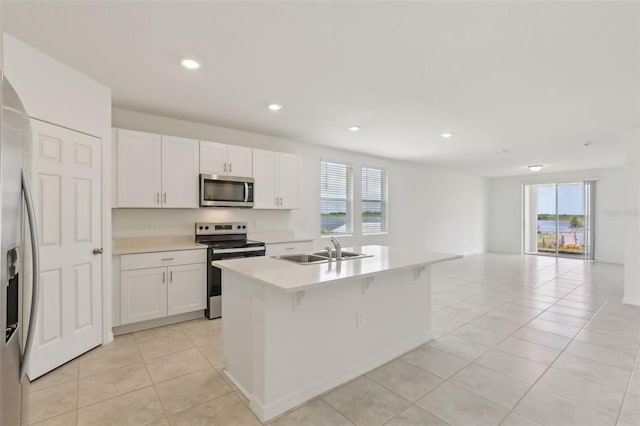 800 Griffon Ave, Lake Alfred, FL 33850 - kitchen with stainless steel appliances, a sink, plenty of natural light, light tile patterned floors, and recessed lighting