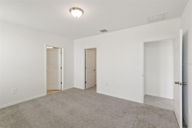 800 Griffon Ave, Lake Alfred, FL 33850 - unfurnished bedroom featuring carpet and baseboards