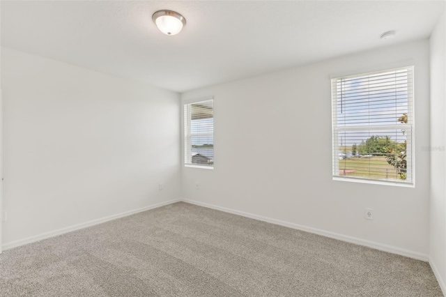 800 Griffon Ave, Lake Alfred, FL 33850 - empty room with carpet flooring, baseboards, and a smoke detector