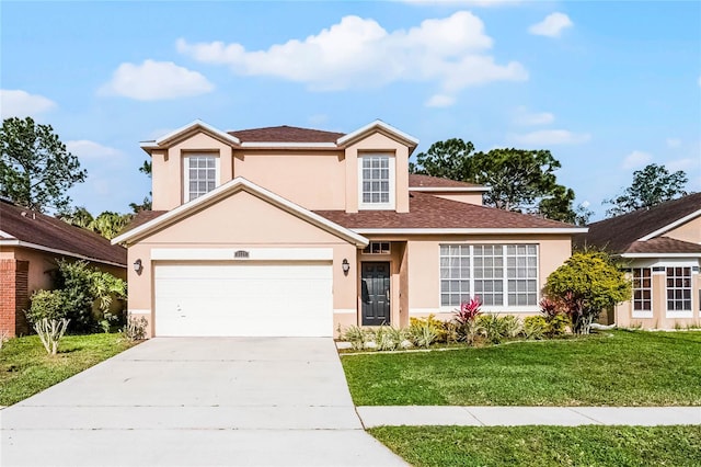 traditional home with stucco siding, a front yard, and driveway