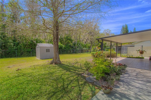 view of yard featuring a storage shed, an outdoor structure, concrete driveway, and a fenced backyard