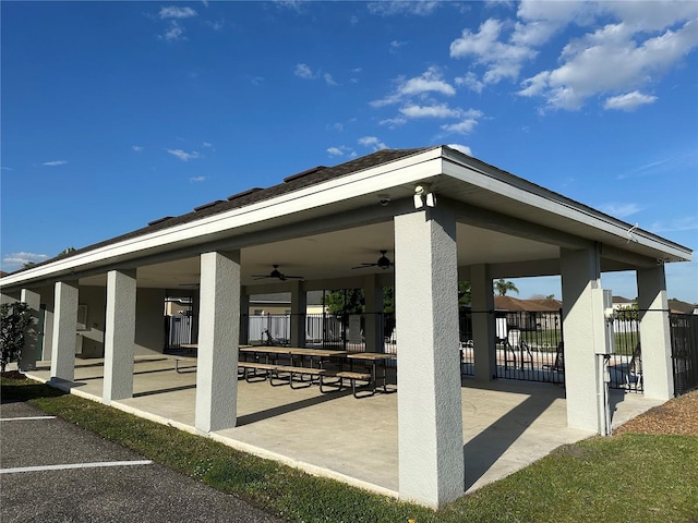 view of home's community with a patio area and fence