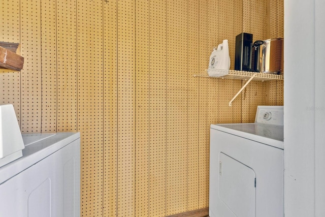 laundry area with laundry area and separate washer and dryer