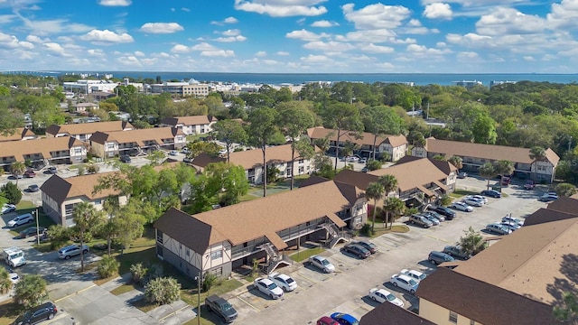 birds eye view of property with a residential view and a water view