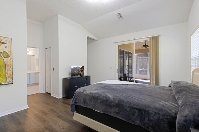 bedroom with visible vents, ensuite bath, dark wood-style flooring, vaulted ceiling, and access to outside