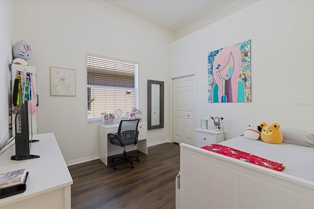 bedroom featuring dark wood finished floors and baseboards