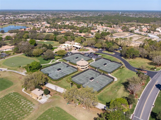 birds eye view of property with a residential view, golf course view, and a water view