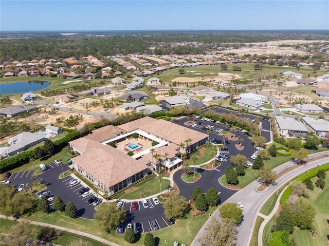 aerial view with a residential view and a water view