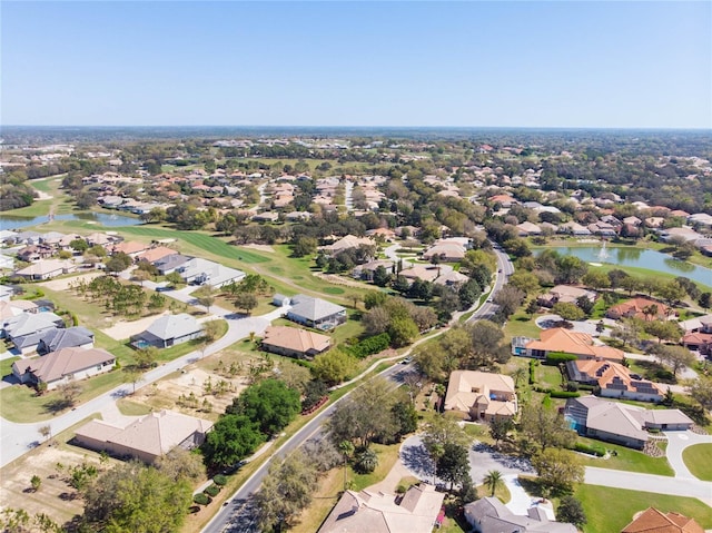 birds eye view of property featuring a residential view and a water view